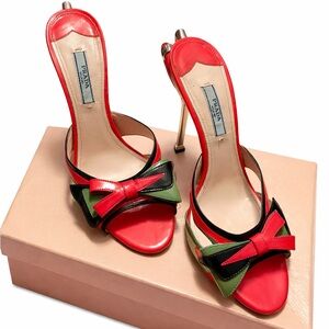 Prada Bow Patent Leather Mule Sandals - Pink
with Black and Green Bow